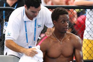 Gael Monfils receiving treatment to a shoulder during an injury timeout
