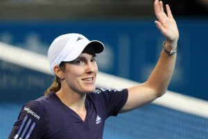 Justine Henin of Belgium waves to the crowd at Pat Rafter Arena