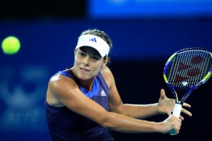 Ana Ivanovic charges the net with a volley