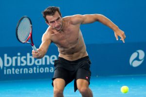 Marinko Matosevic couldn't find his shirt, but it didn't stop him from hitting the court. Tennis Australia.