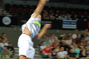 Lukasz Kubot reaches high to take on Baghdatis.