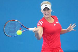 Wild card Isabella Holland in a dark pink number, worn in a qualifying match against Arantxa Rus, where she was defeated 6-2 6-2.