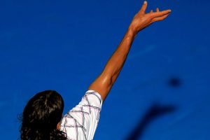 Feliciano Lopez tosses to serve.