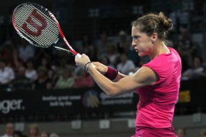 Petkovic using every muscle in her body to return Kvitova's serve.
