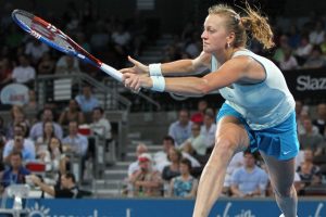 Petra Kvitova stretches out long to hit the ball.