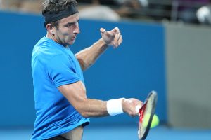 Marinko Matosevic stuck with defending champion Andy Roddick in the first feature night match of the Brisbane International but ended up falling in straight sets.