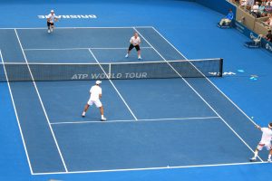 Robert Lindstedt, who later retired due to a calf injury - hits a forehand.