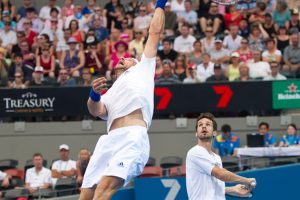 Jurgen Melzer flies for a smash while Philipp Petzschner watches. SMP IMAGES