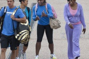 Serena Williams arrives at the Queensland Tennis Centre with her team. SMP IMAGES