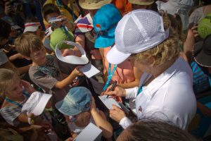Some lucky kids not only got to have a hit with Kim Clijsters but also got the Belgian star's autograph. SMP IMAGES