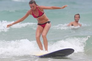 Daniela Hantuchova hits the waves with pro surfer Julian Wilson. Sunshine Coast, Queensland. GETTY IMAGES.