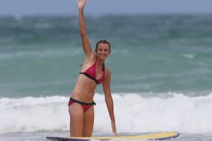 Daniela Hantuchova hits the waves with pro surfer Julian Wilson. Sunshine Coast, Queensland. GETTY IMAGES.