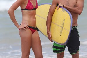 Daniela Hantuchova hits the waves with pro surfer Julian Wilson. Sunshine Coast, Queensland. GETTY IMAGES.