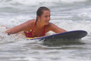 Daniela Hantuchova hits the waves with pro surfer Julian Wilson. Sunshine Coast, Queensland. GETTY IMAGES.