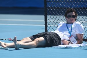 Golfer Rory McIlroy watches Caroline Wozniacki. Brisbane International. GETTY IMAGES