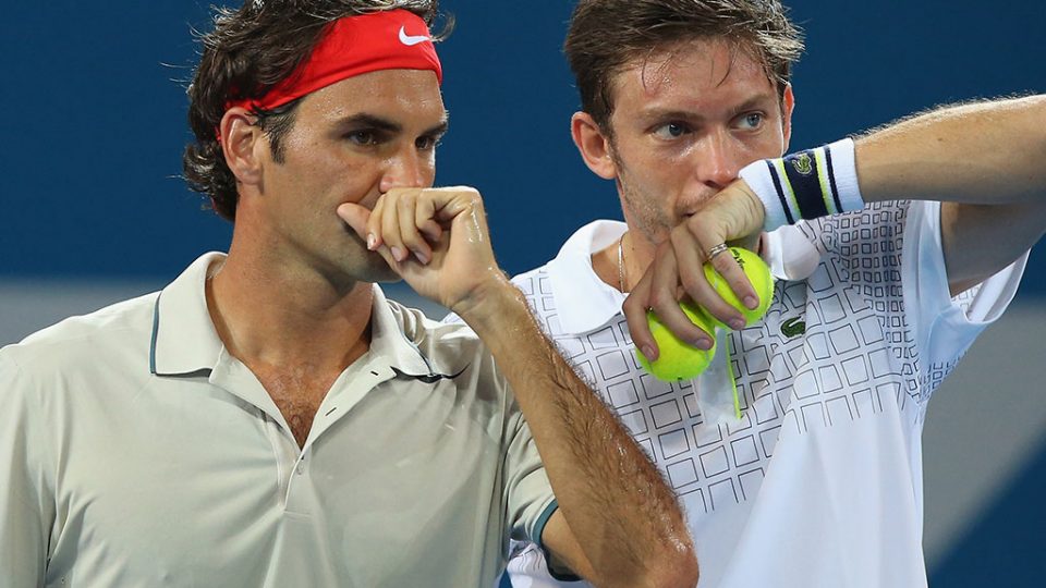 Roger Federer and Nicolas Mahut, Brisbane International, 2014. GETTY IMAGES
