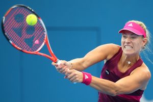 BRISBANE, AUSTRALIA - JANUARY 06:  Angelique Kerber of Germany plays a backhand in her match against Daria Gavrilova of Russia during day three of the 2015 Brisbane International at Pat Rafter Arena on January 6, 2015 in Brisbane, Australia.  (Photo by Chris Hyde/Getty Images)
