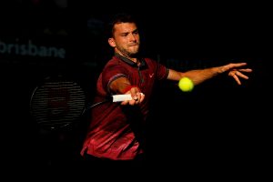 BRISBANE, AUSTRALIA - JANUARY 10:  Grigor Dimitrov of Bulgaria plays a forehand in the Men's semi final match against Roger Federer of Switzerland  during day seven of the 2015 Brisbane International at Pat Rafter Arena on January 10, 2015 in Brisbane, Australia.  (Photo by Chris Hyde/Getty Images)