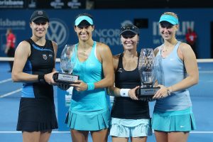 BRISBANE, AUSTRALIA - JANUARY 10:  Martina Hingis and Sabine Lisicki hold the winners trophy while Caroline Garcia and Katarina Srebotnik hold the runner up trophy after the Womens final on day seven of the 2015 Brisbane International at Pat Rafter Arena on January 10, 2015 in Brisbane, Australia.  (Photo by Chris Hyde/Getty Images)