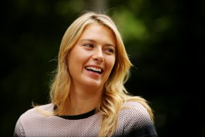 BRISBANE, AUSTRALIA - JANUARY 11:  Maria Sharapova smiles during an interview at the Brisbane Botanic Gardens after winning the Womens 2015 Brisbane International on January 11, 2015 in Brisbane, Australia.  (Photo by Chris Hyde/Getty Images)