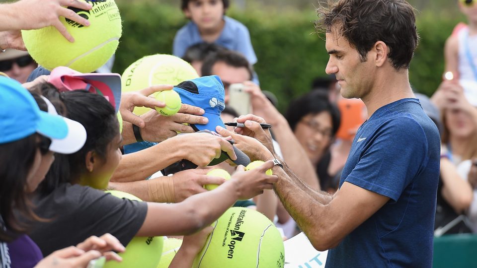 Roger Federer signs autographs during day one of the 2016 Brisbane International. Picture: GETTY IMAGES