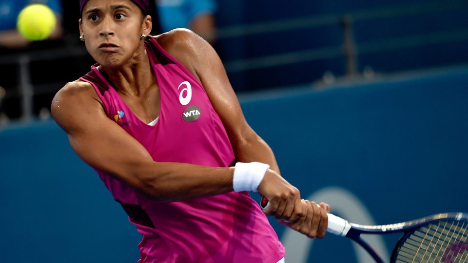 Teliana Pereira of Brazil hits a return against Andrea Petkovic of Germany in their first round match. Picture: GETTY IMAGES