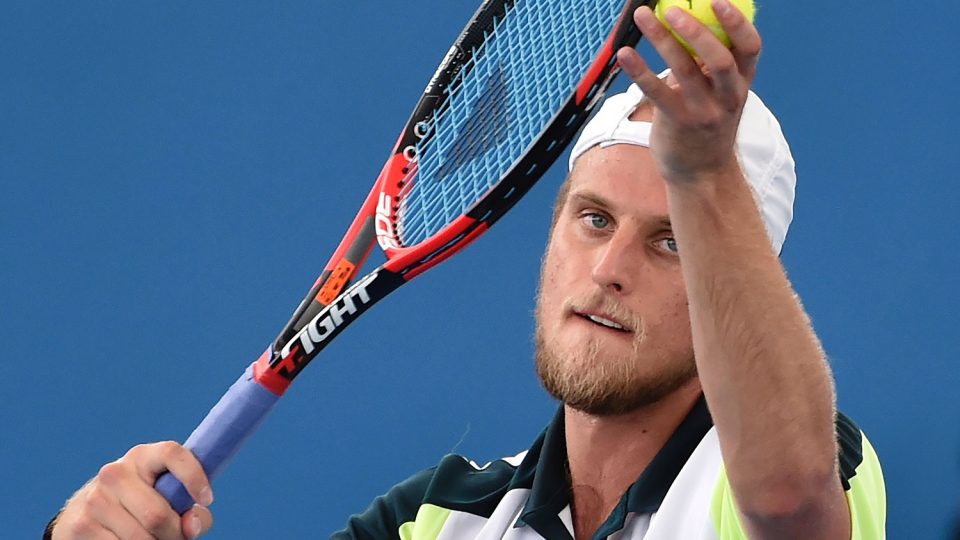 Denis Kudla of the US serves against John-Patrick Smith of Australia. Picture: GETTY IMAGES