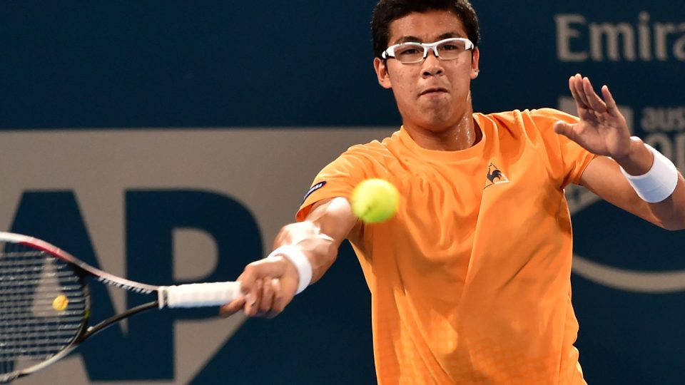Hyeon Chung of South Korea hits a return against Sam Groth. Picture: GETTY IMAGES