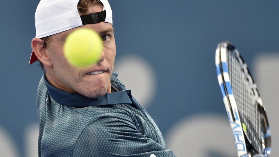 James Duckworth of Australia hits a return against  Austria's Dominic Thiem. Picture: GETTY IMAGES