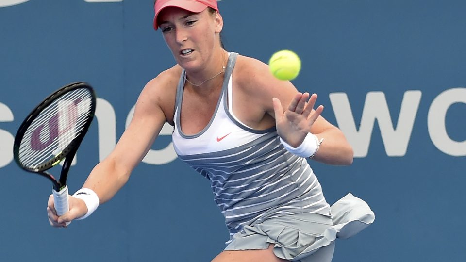 Madison Brengle of the US hits a return against Angelique Kerber of Germany. Picture: GETTY IMAGES