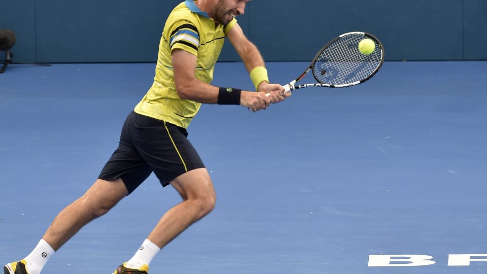 Mikhail Kukushkin of Kazakhstan hits a return against Japan's Kei Nishikori. Picture: GETTY IMAGES