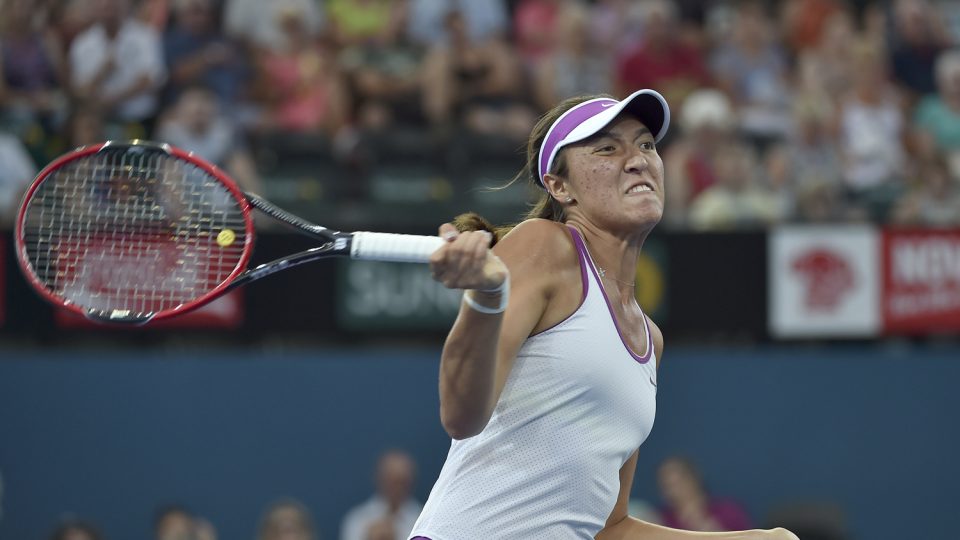 Samantha Crawford of the US hits a high ball against Andrea Petkovic of Germany. Picture: GETTY IMAGES