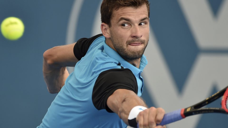 Bulgaria's Grigor Dimitrov hits a return against Serbia's Viktor Troicki. Picture: GETTY IMAGES