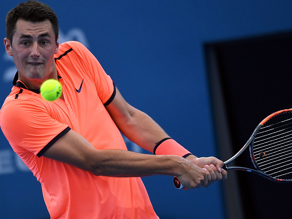 Bernard Tomic hits a backhand during his loss to David Ferrer in Brisbane - PHOTO: Getty Images