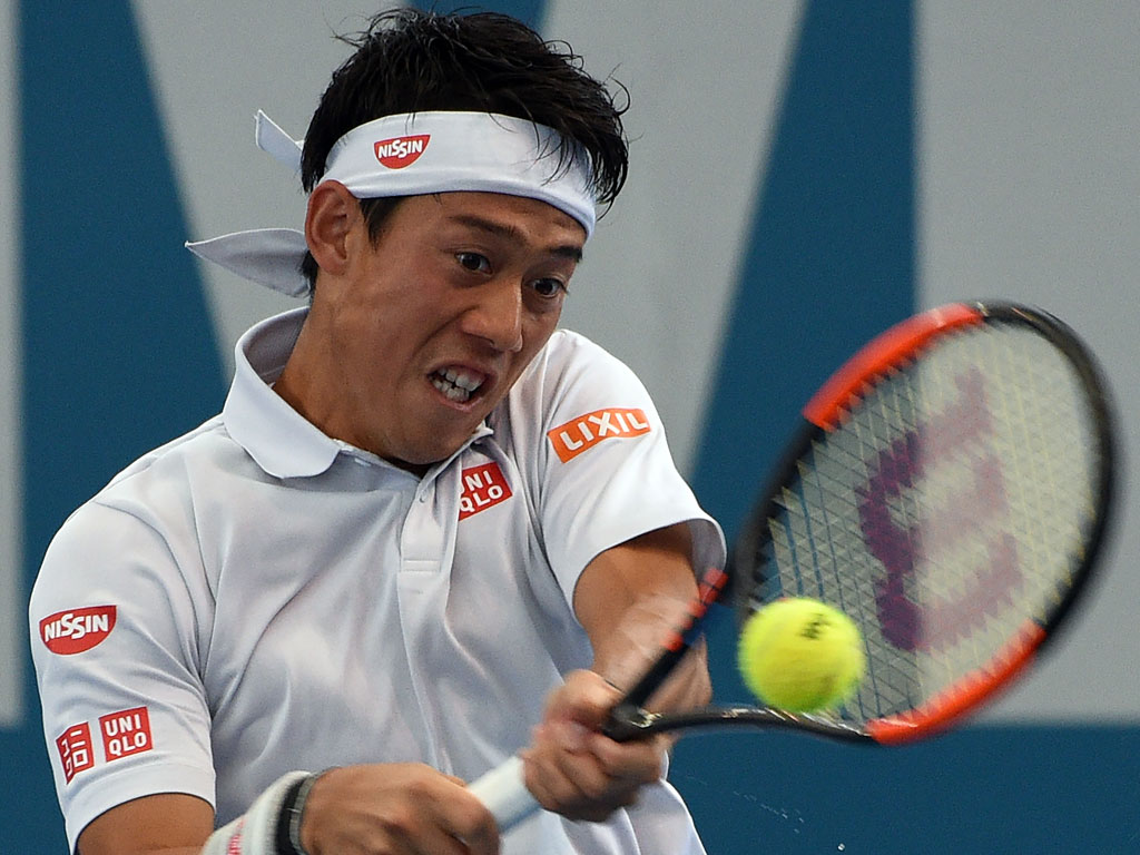 Kei Nishikori in doubles action on Day 3 of the Brisbane International - PHOTO: Getty Images