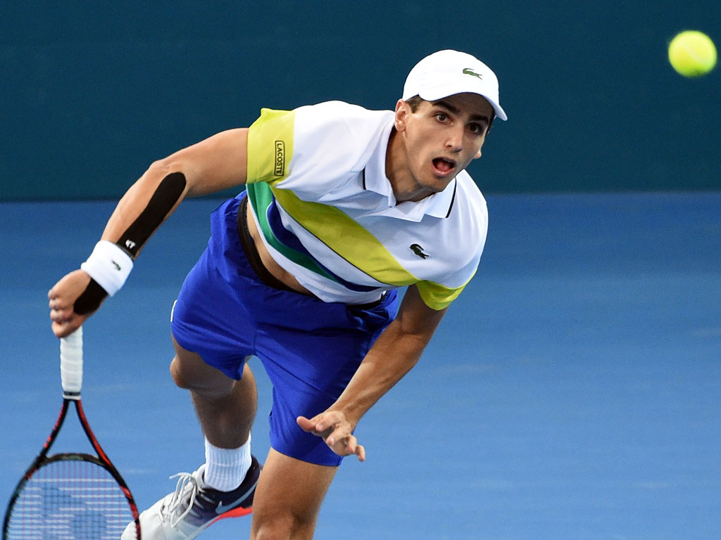 Pierre-Hugues Herbert serves during his loss to Sam Groth in Brisbane - PHOTO: Getty Images